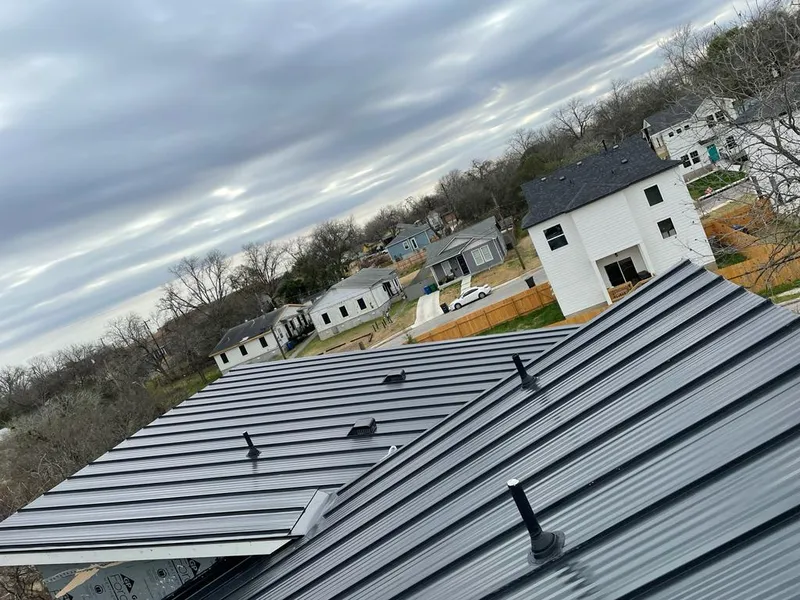 Standing seam metal roof panels with vents for Skylight Repair in St. Ann